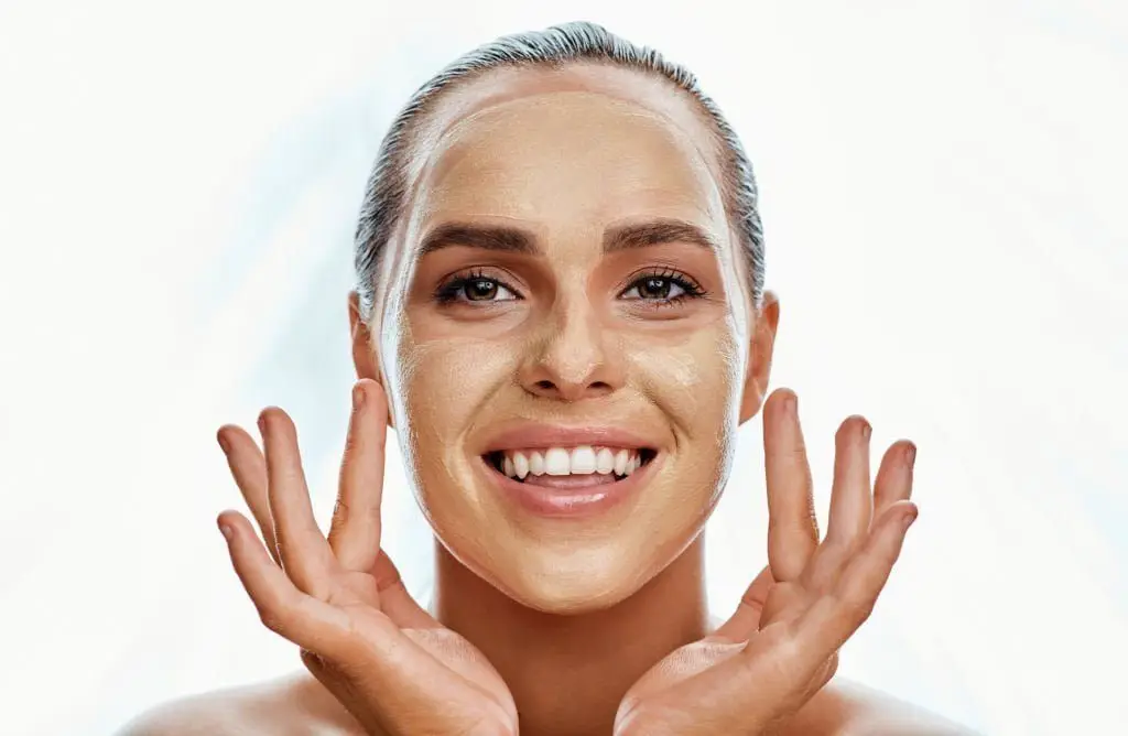 Shot of a beautiful young woman wearing a face mask against a white background