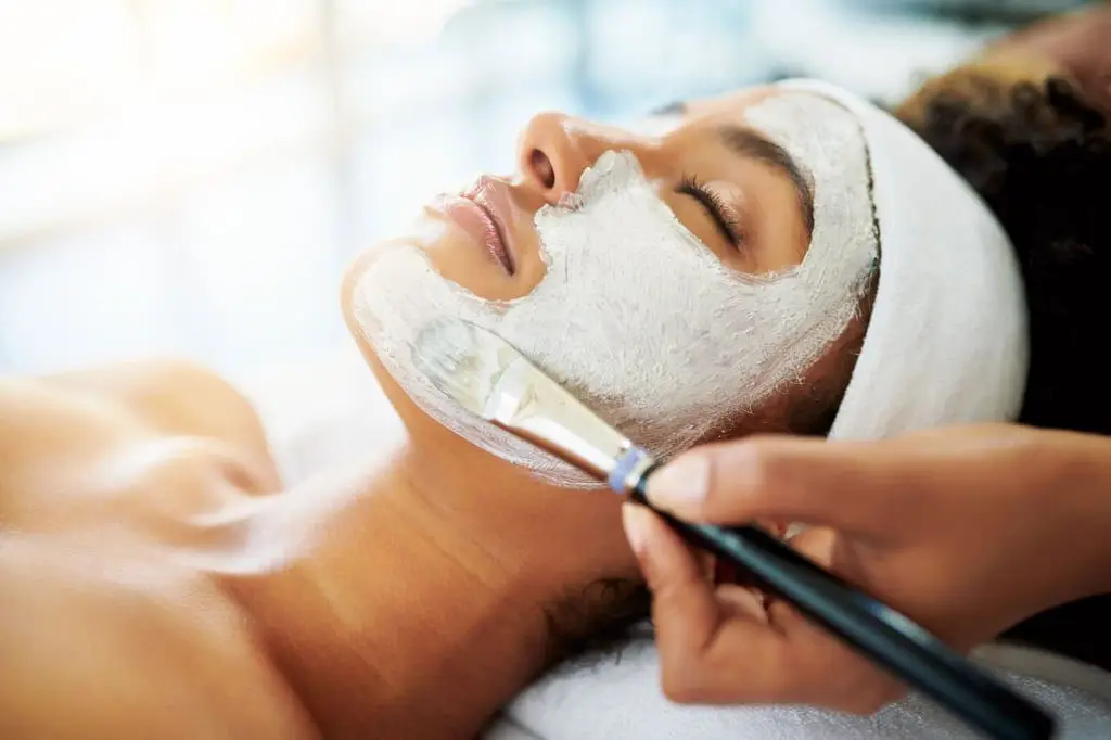 Shot of an attractive young woman getting a facial at a beauty spa