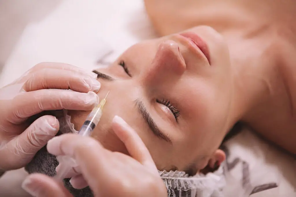 Woman getting restylane filler in roswell