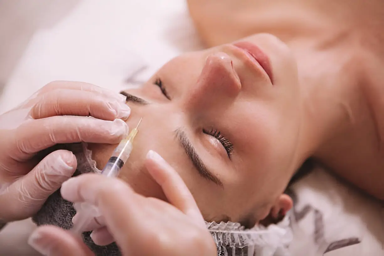 Woman getting restylane filler in roswell