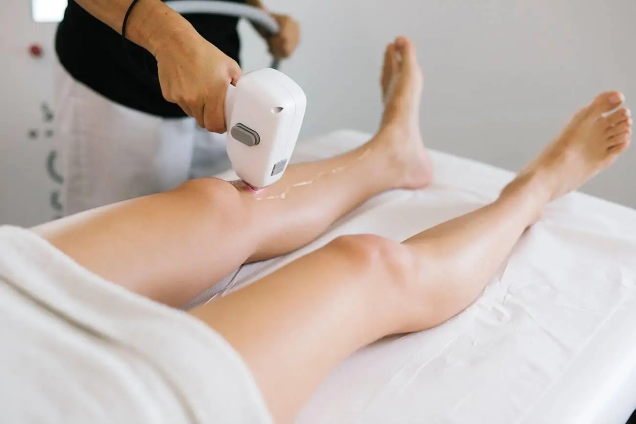 A woman with smooth, hair-free skin used to provide answers to common questions about laser hair removal treatments.