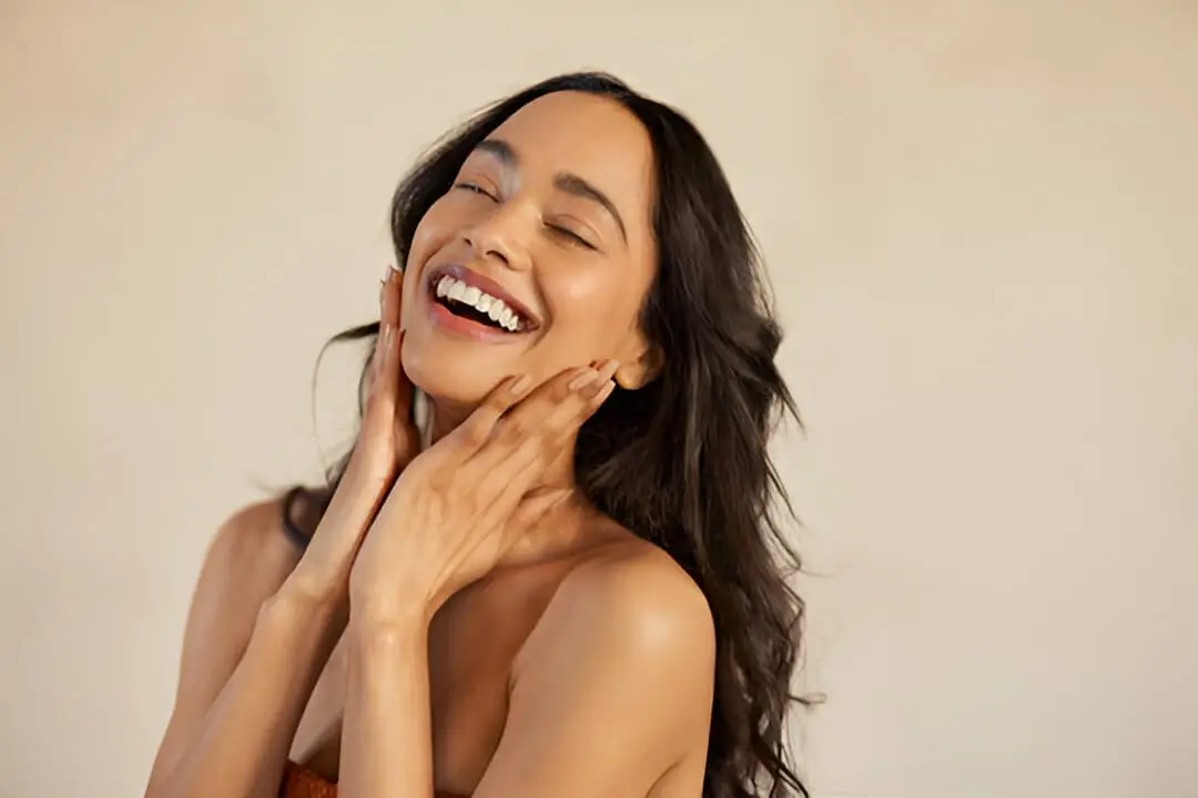 A vibrant, energized woman representing the improved mood and skin health benefits of Bioidentical Hormone Pellet Therapy.