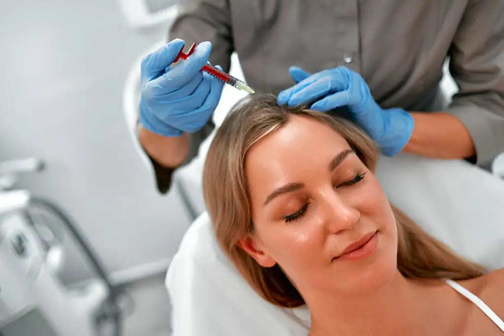 A person with healthy, dense hair illustrating the natural approach to hair loss restoration using PRP therapy at our Roswell clinic.