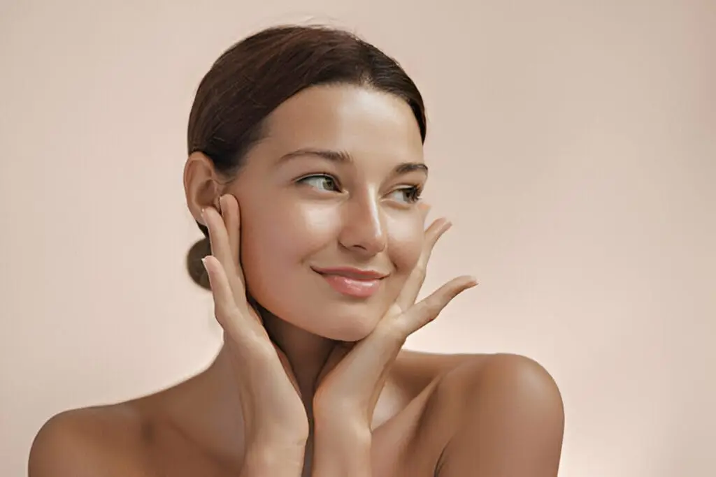 A woman with radiant skin used to represent the importance of following pre and post-treatment care for optimal aesthetic results.