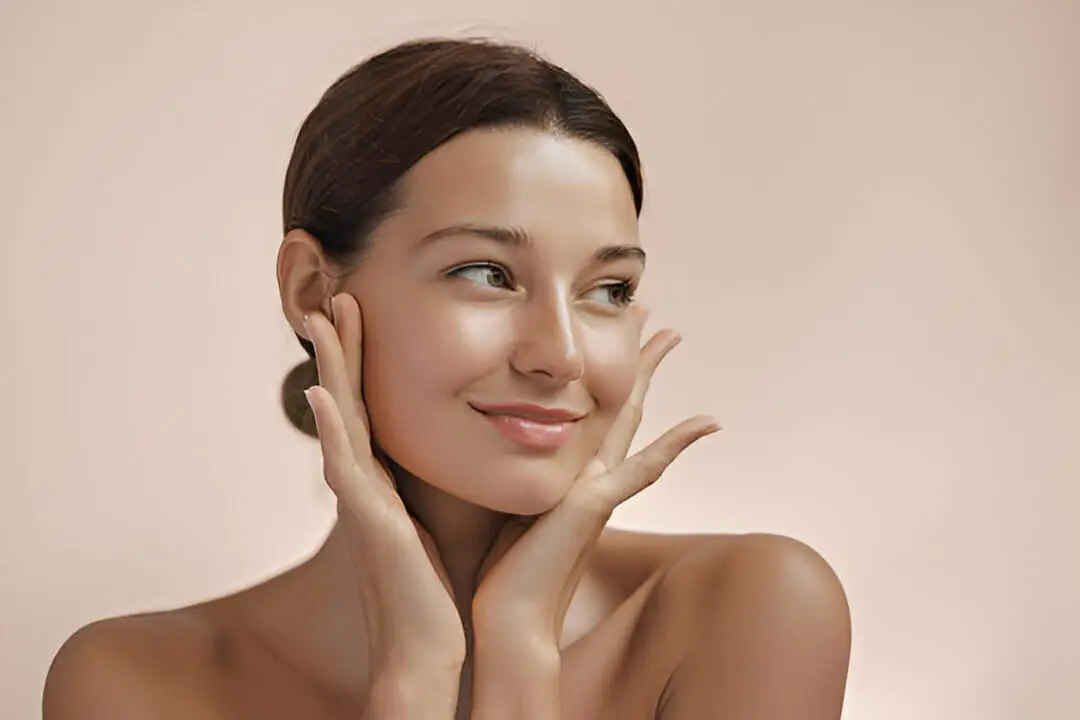 A woman with radiant skin used to represent the importance of following pre and post-treatment care for optimal aesthetic results.