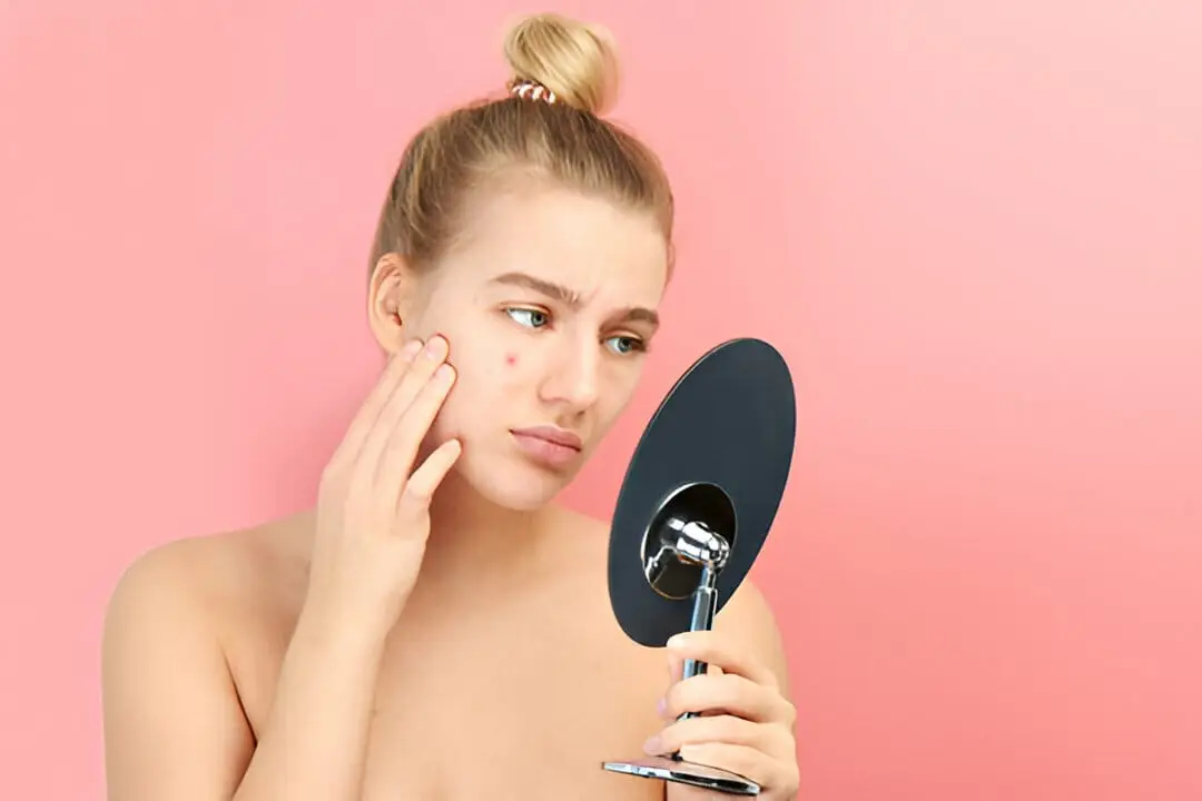 A woman with a clear, healthy complexion representing the effective hormonal acne treatments and clinical solutions available at our Roswell med spa.