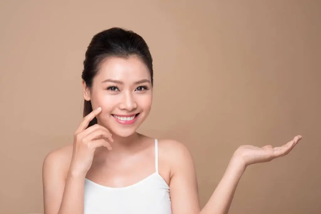A woman with smooth, hair-free skin used to debunk common misconceptions about laser hair removal for clients in Roswell, GA.