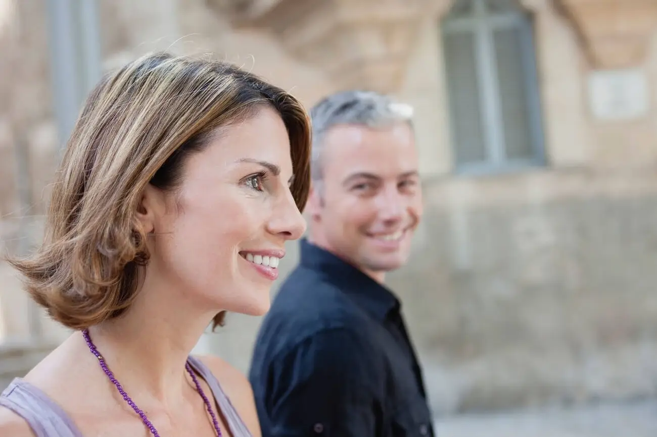 couple walking along the street with energy and fresh mood